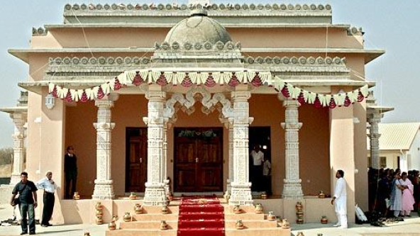 The exterior of a traditional temple in Gaborone, Botswana, with intricate architectural details.