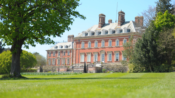 Bryanston School, Dorset: A scenic view of Bryanston School in Dorset, surrounded by greenery.