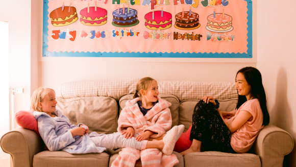 Boarders at Port Regis School reclining on a sofa