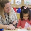 Pre-school pupil doing some colouring in at DUCKS