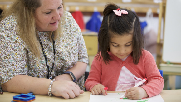 Pre-school pupil doing some colouring in at DUCKS