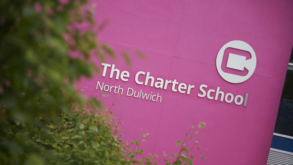 The large sign on the wall of The Charter School, North Dulwich, showing the school's name