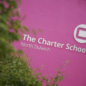 The large sign on the wall of The Charter School, North Dulwich, showing the school's name