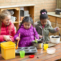 Messy play in the nursery's mud kitchen