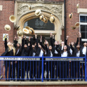 Pupils at Watford Grammar School for Girls toss their straw hats in the air.