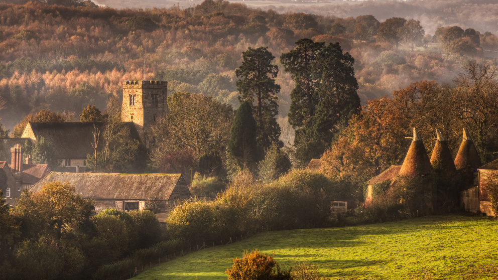 Autumnal landscape of Kent village, featuring classic Kentish Oast houses