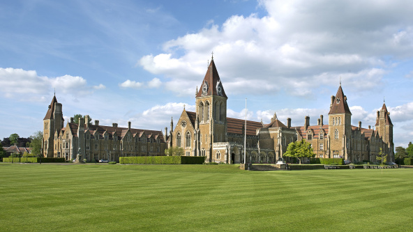 A view of Charterhouse school from across perfectly cut lawns.