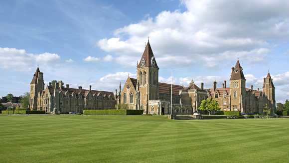 A view of Charterhouse school from across perfectly cut lawns.