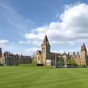 A view of Charterhouse school from across perfectly cut lawns.