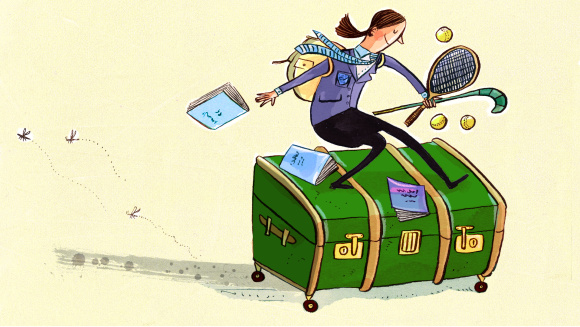 A school child sitting on a trunk returning back to the UK