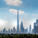 Dubai skyline on a blue sky with the Burj Khalifa central