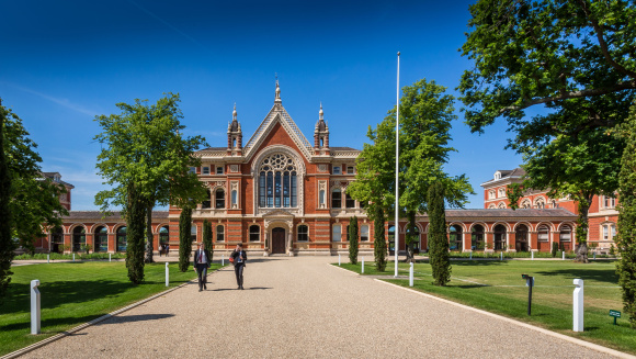 A picture showing two boys in uniform walking away from the Barry Building at Dulwich College, London