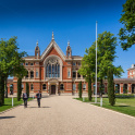 A picture showing two boys in uniform walking away from the Barry Building at Dulwich College, London