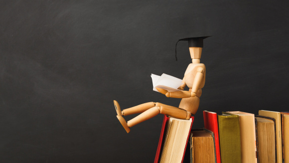 results day marionette in graduation hat