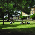 Summer time at the Graveney School in Tooting and pupils are sitting on the grass during break.