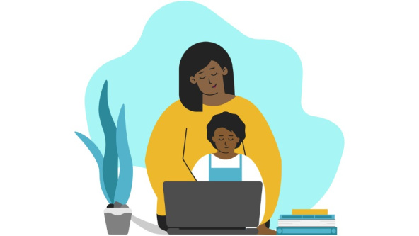 A parent helping a child do school work from home