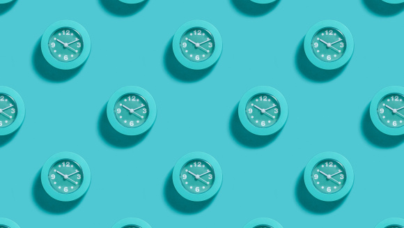 Lots of clocks on a blue background