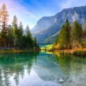 Hintersee lake. Beautiful scene of trees near turquoise water of Hintersee lake. Location: resort Ramsau, National park Berchtesgadener Land, Upper Bavaria, Germany