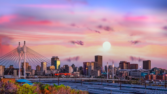 Johannesburg city skyline and Nelson Mandela bridge at sunset