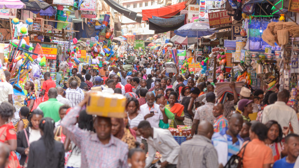 People go about their everyday business in Kikuubo, one of Kampala's busiest trading areas.