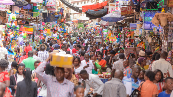 People go about their everyday business in Kikuubo, one of Kampala's busiest trading areas.