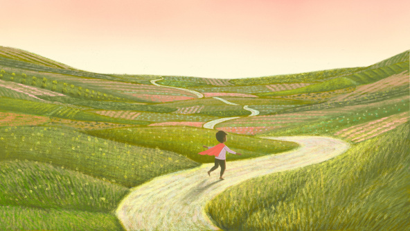 A child in a superhero cape running through fields