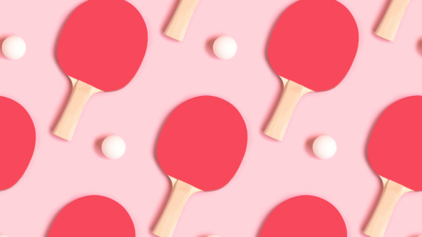 Repetitive pattern of tennis rackets and white balls on a pink background