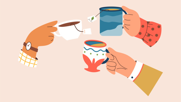 Hands holding cups of tea