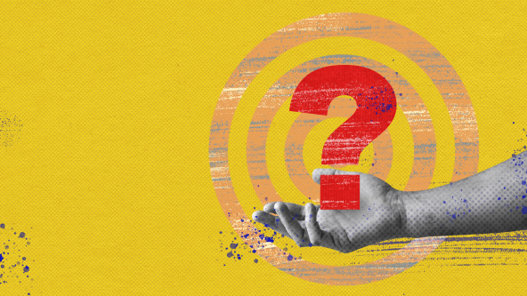 A red question make being held by a black and white hand on a yellow background with a target