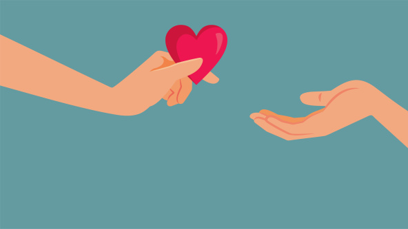 One hand giving another hand a heart