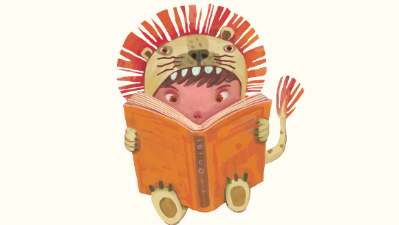 A child in a lion costume reading a book