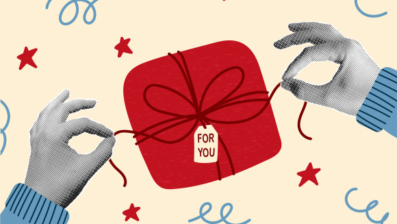 Two hands opening a present