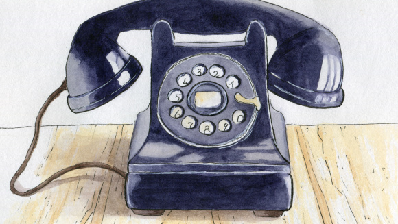 A black rotary telephone