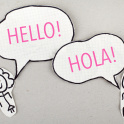 Two cut out illustrations of children saying hello and hola