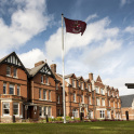 The facade of Kent College, Canterbury, with the school's flag flying high on the flagpole