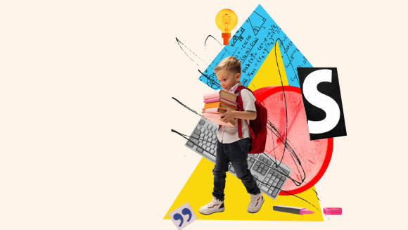 A small school boy carrying books