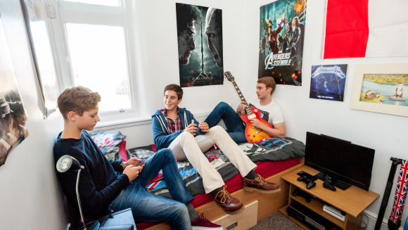 Sixth form pupils in a boarder's room at Rossall School
