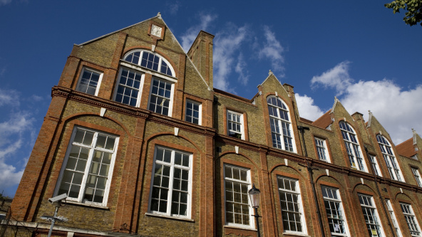 Exterior of independent school under a blue sunny sky.