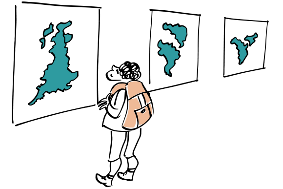 A child looking at maps in a gallery