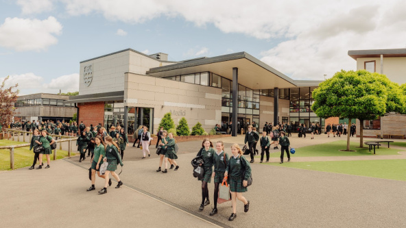 Pupils in uniform walking away from Weydon School, Farnham