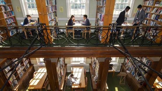 Pupils working at desks in Aldenham School Library