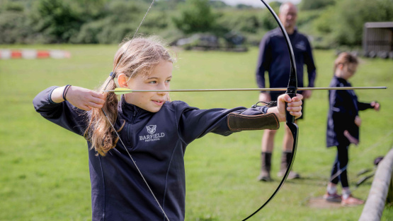 Barfield School pupil drawing a bow and arrow