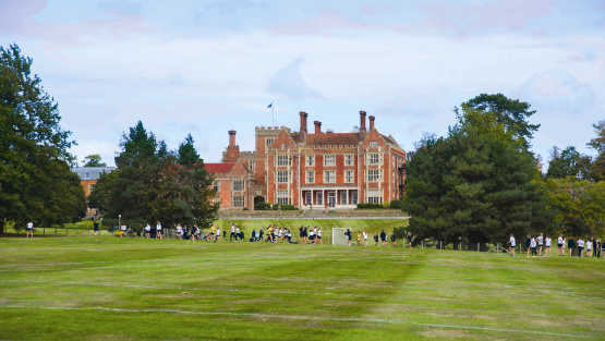 Main building of Benendent School with hockey fields in the foreground