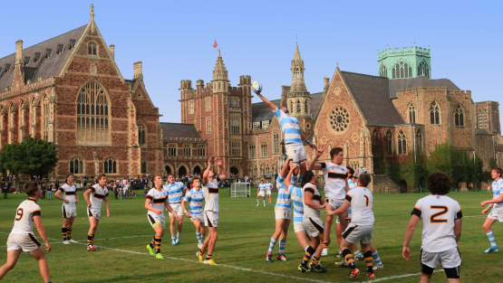 Line-out during a rugby match at Clifton College Clifton College, featuring historic architecture and expansive green lawns.