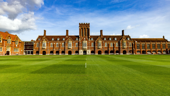 The view across a pristine sports pitch of Eastbourne College's Memorial Building