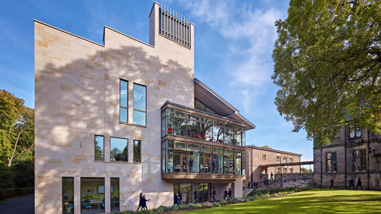 The exterior of the Spens building at Fettes College. A mix of warm Scottish stone and modern metal-framed glass windows