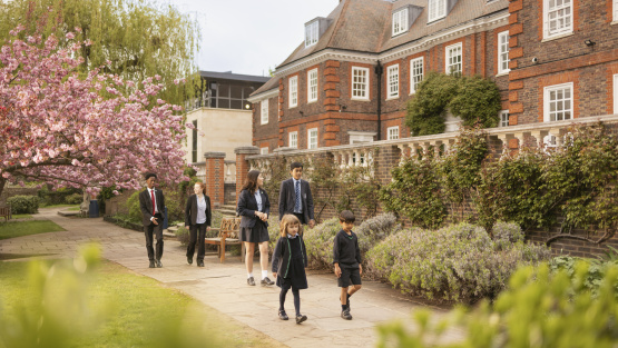 Pupils walk along a path at Ibstock Place School