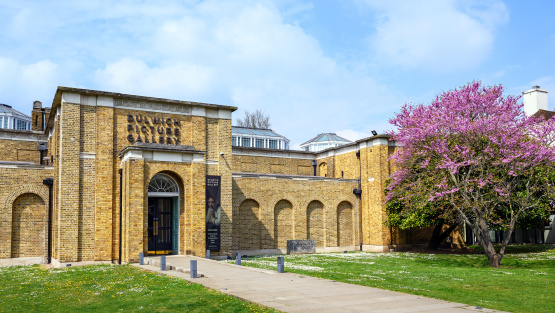 The entrance to Dulwich Picture Gallery with a blossoming tree outside
