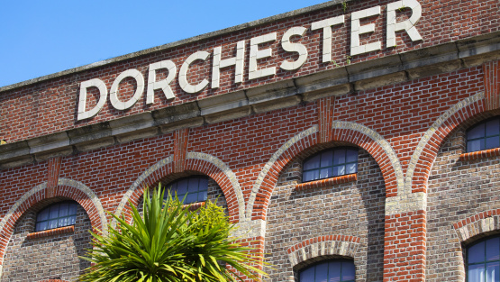 'Dorchester' written in large capital letters, high up on a building in Brewery Square, Dorchester