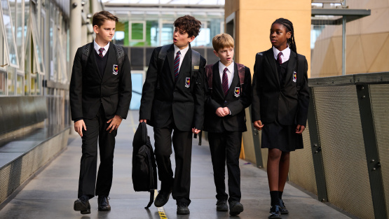 Pupils at Kingsdale Foundation School walking along a corridor